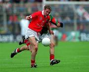 24 September 2000; James Masters of Cork is tackled by Dermot Geraghty of Mayo during the All Ireland Minor Football Championship Final match between Cork and Mayo at Croke Park in Dublin. Photo by Ray Lohan/Sportsfile