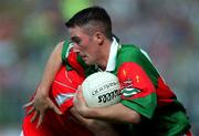 24 September 2000; Alan Dillon of Mayo is tackled by Mark O'Connor of Cork during the All Ireland Minor Football Championship Final match between Cork and Mayo at Croke Park in Dublin. Photo by Ray McManus/Sportsfile