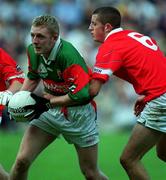 24 September 2000; Paul Carey of Mayo is tackled by Denis O'Hare of Cork during the All Ireland Minor Football Championship Final match between Cork and Mayo at Croke Park in Dublin. Photo by Ray McManus/Sportsfile