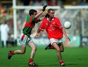 24 September 2000; Paul McCarthy of Cork is tackled by Paul Prenty of Mayo during the All Ireland Minor Football Championship Final match between Cork and Mayo at Croke Park in Dublin. Photo by Ray Lohan/Sportsfile