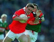 24 September 2000; Conor Brosnan of Cork is tackled by Rory Keane of Mayo during the All Ireland Minor Football Championship Final match between Cork and Mayo at Croke Park in Dublin. Photo by Matt Browne/Sportsfile