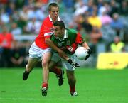 24 September 2000; Ronan Walshe of Mayo is tackled by Kieran McMahon of Cork during the All Ireland Minor Football Championship Final match between Cork and Mayo at Croke Park in Dublin. Photo by Ray McManus/Sportsfile