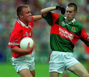 24 September 2000; Conrad Murphy of Cork is tackled by Enda Devenney of Mayo during the All Ireland Minor Football Championship Final match between Cork and Mayo at Croke Park in Dublin. Photo by Matt Browne/Sportsfile