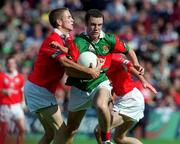 24 September 2000; Alan Burke of Mayo is tackled by John Collins, right, and Kieran Collins of Cork during the All Ireland Minor Football Championship Final match between Cork and Mayo at Croke Park in Dublin. Photo by Ray McManus/Sportsfile