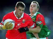 24 September 2000; Garry McLoughlin of Cork is tackled by Ronan Walshe of Mayo during the All Ireland Minor Football Championship Final match between Cork and Mayo at Croke Park in Dublin. Photo by Matt Browne/Sportsfile