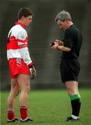 25 February 2001; Derry's Paul Carton is booked by referee Paddy Russell during the Allianz National Football League Division 1B match between Meath and Derry at Páirc Tailteann in Navan, Meath. Photo by Damien Eagers/Sportsfile