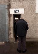 25 February 2001; Patrons use a turnstile featuring the price of seven pounds sterling at Páirc Tailteann ahead of the Allianz National Football League Division 1B match between Meath and Derry in Navan, Meath. Photo by Damien Eagers/Sportsfile