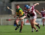 25 February 2001; Seamus McMullan of Dunloy is tackled by Paul Hardiman and Brian Hanley of Athenry during the AIB All-Ireland Senior Club Hurling Championship Semi-Final match between Athenry and Dunloy at Parnell Park in Dublin. Photo by Ray Lohan/Sportsfile