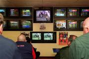 3 March 2001; Customers attending a Betting shop in Kildare Town watch on at screens as all sporting events in Ireland have been postponed as a precautionary measure against Foot and Mouth disease. Photo by Damien Eagers/Sportsfile