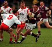 25 February 2001; Kieran Comer of Galway in action against Pascal Canavan, 9, of Tyrone during the Allianz National Football League Division 1A match between Galway and Tyrone at Duggan Park in Ballinasloe, Galway. Photo by Ray McManus/Sportsfile