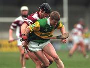 25 February 2001; Malachy Molloy of Dunloy is tackled by Joe Rabbitte of Athenry during the AIB All-Ireland Senior Club Hurling Championship Semi-Final match between Athenry and Dunloy at Parnell Park in Dublin. Photo by Ray Lohan/Sportsfile