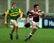 25 February 2001; Pat Higgins of Athenry in action against Malachy Molloy of Dunloy during the AIB All-Ireland Senior Club Hurling Championship Semi-Final match between Athenry and Dunloy at Parnell Park in Dublin. Photo by Ray Lohan/Sportsfile