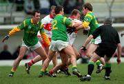 25 February 2001; Johnny McBride of Derry under pressure from Meath players Mark O'Reilly, 2, Darren Fay and Hank Traynor during the Allianz National Football League Division 1B match between Meath and Derry at Páirc Tailteann in Navan, Meath. Photo by Damien Eagers/Sportsfile