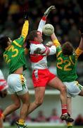 25 February 2001; Anthony Tohill of Derry under pressure from Nigel Nestor, left, and Dermot Kealy of Meath during the Allianz National Football League Division 1B match between Meath and Derry at Páirc Tailteann in Navan, Meath. Photo by Damien Eagers/Sportsfile