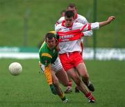 25 February 2001; Evan Kelly of Meath is tackled by Paul McFlynn of Derry during the Allianz National Football League Division 1B match between Meath and Derry at Páirc Tailteann in Navan, Meath. Photo by Damien Eagers/Sportsfile