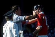 2 September 1990; Kevin Hennessy, Cork, has an injury tended to during the All-Ireland Senior Hurling Championship Final between Cork and Galway at Croke Park in Dublin. Photo by Ray McManus/Sportsfile