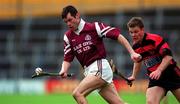 28 November 1999; Greg Baker of St. Joseph's Doora-Barefield in action against Niall O'Donnell of Ballygunner during the AIB Munster Senior Club Hurling Championship Final match between Ballygunner and St. Joseph's Doora-Barefield at Semple Stadium in Thurles, Tipperary. Photo by Ray McManus/Sportsfile