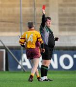 1 November 2009; Jonathan McGuirk, Craobh Chiaráin, is shown the red card by referee Eoin Mullerky. Dublin County Senior Hurling Final, Ballyboden St. Enda's v Craobh Chiaráin, Parnell Park, Dublin. Picture credit: Pat Murphy / SPORTSFILE