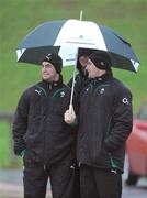 4 November 2009; Rob Kearney, left, Leo Cullen and David Wallace shelter under a brolly during Ireland rugby squad training. University of Limerick, Limerick. Picture credit: Brendan Moran / SPORTSFILE