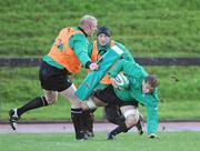 4 November 2009; Flanker Chris Henry in action against Paul O'Connell and Neil Best during Ireland rugby squad training. University of Limerick, Limerick. Picture credit: Brendan Moran / SPORTSFILE