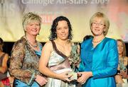 7 November 2009; Aoife Neary, of Kilkenny, is presented with her Camogie All-Star award by Joan O'Flynn, President oif the Camogie Association, and Mary Hanafin T.D., Minister for Social and Family Affairs, during the 2009 Camogie All-Stars Awards, in association with O'Neills. Citywest Hotel, Conference, Leisure & Golf Resort, Dublin. Picture credit: Pat Murphy / SPORTSFILE