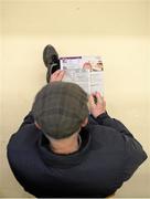 24 January 2016; A general view of a racegoer marking their racecard during the day's racing. Leopardstown Racecourse, Leopardstown, Co. Dublin. Photo by Sportsfile