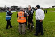 24 January 2016; Páirc Tailteann officials consult with referee Brendan Cawley before the start time for the game was pushed back to 2.40pm. Bord na Mona O'Byrne Cup Final, Meath v Longford. Páirc Táilteann, Navan, Co. Meath. Picture credit: Piaras Ó Mídheach / SPORTSFILE
