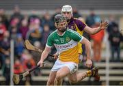 24 January 2016; Sean Cleary, Offaly, in action against Andrew Shore, Wexford. Bord na Mona Walsh Cup, Semi-Final, Wexford v Offaly, Kennedy Park, New Ross, Co. Wexford. Picture credit: Sam Barnes / SPORTSFILE