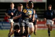 25 January 2016; Moyo Mobalaji, King's Hospital, is tackled by Max McGloin, Dundalk Grammar. Bank of Ireland Schools Fr. Godfrey Cup, Semi-Final, King's Hospital v Dundalk Grammar. Templeville Road, Dublin. Picture credit: Seb Daly / SPORTSFILE