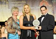 7 November 2009; Catherine McGourty, Down, is presented with her Camogie Soaring Star award by Joan O'Flynn, President of the Camogie Association, and Paul Brady, three times World Handball Champion, during the 2009 Camogie Soaring Star Awards, in association with O'Neills. Citywest Hotel, Conference, Leisure & Golf Resort, Dublin. Picture credit: Pat Murphy / SPORTSFILE