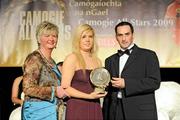 7 November 2009; Eimear Moynan, Laois, is presented with her Camogie Soaring Star award by Joan O'Flynn, President of the Camogie Association, and Paul Brady, three times World Handball Champion, during the 2009 Camogie Soaring Star Awards, in association with O'Neills. Citywest Hotel, Conference, Leisure & Golf Resort, Dublin. Picture credit: Pat Murphy / SPORTSFILE