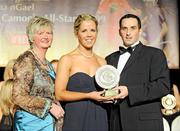 7 November 2009; Karen Kelly, Waterford, is presented with her Camogie Soaring Star award by Joan O'Flynn, President of the Camogie Association, and Paul Brady, three times World Handball Champion, during the 2009 Camogie Soaring Star Awards, in association with O'Neills. Citywest Hotel, Conference, Leisure & Golf Resort, Dublin. Picture credit: Pat Murphy / SPORTSFILE