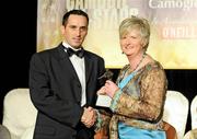 7 November 2009; Three times World Handball Champion Paul Brady is presented with a trophy by Joan O'Flynn, President of the Camogie Association, in recognition of his world title during the 2009 Camogie All-Stars Awards, in association with O'Neills. Citywest Hotel, Conference, Leisure & Golf Resort, Dublin. Picture credit: Pat Murphy / SPORTSFILE