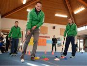 26 January 2016; Minister for Health Leo Varadkar, centre, is coached through the hockey skills challenge by Hockey Ireland players Megan Frazer, left, and Nicci Daly, right, at a Hockey Ireland - Hockey Skills Challenge Blakestown. Scoil Mhuire, Blakestown, Dublin. Picture credit: Seb Daly / SPORTSFILE