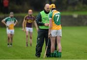24 January 2016; Pat Camon, Offaly, is tended too by Offaly physio Nicholas Lalor. Bord na Mona Walsh Cup, Semi-Final, Wexford v Offaly, Kennedy Park, New Ross, Co. Wexford. Picture credit: Sam Barnes / SPORTSFILE