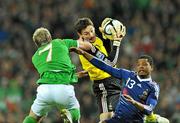 14 November 2009; Hugo Lloris, and Patrice Evra, France, in action against Liam Lawrence, Republic of Ireland. FIFA 2010 World Cup Qualifying Play-off 1st Leg, Republic of Ireland v France, Croke Park, Dublin. Picture credit: David Maher / SPORTSFILE
