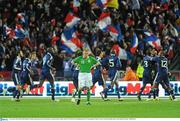 14 November 2009; Damien Duff, Republic of Ireland, stands dejected, as the French players celebrate Nicolas Anelka's goal. FIFA 2010 World Cup Qualifying Play-off 1st Leg, Republic of Ireland v France, Croke Park, Dublin. Picture credit: Stephen McCarthy / SPORTSFILE