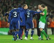 14 November 2009; Richard Dunne, Republic of Ireland, and goalkeeeping coach Alan Kelly are involved in an altercation with Bacary Sagne, France, following the final whistle. FIFA 2010 World Cup Qualifying Play-off 1st Leg, Republic of Ireland v France, Croke Park, Dublin. Picture credit: Stephen McCarthy / SPORTSFILE