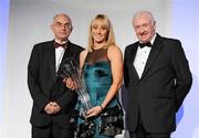14 November 2009; Track Athlete of the Year Derval O’Rourke, Leevale AC, is presented with her award by Liam Hennessy, President AAI, left, and Ray Colman, Chief Executive Woodie’s DIY, at the National Athletics Awards Night in association with Woodie’s DIY and Tipperary Crystal. Crowne Plaza, Santry, Co. Dublin. Picture credit: Pat Murphy / SPORTSFILE