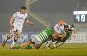 30 January 2016; Darren Cave, Ulster, is tackled by Thomas Palmer and Simone Ferrari, Benetton Treviso. Guinness Pro 12, Round 13, Treviso v Ulster, Monigo Stadium, Treviso, Italy. Picture credit: Max Pratelli / SPORTSFILE
