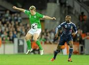 14 November 2009; Kevin Doyle, Republic of Ireland, in action against William Gallas, France. FIFA 2010 World Cup Qualifying Play-off 1st Leg, Republic of Ireland v France, Croke Park, Dublin. Picture credit: Stephen McCarthy / SPORTSFILE