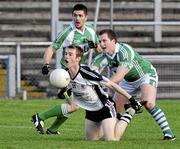 15 November 2009; Paul McFlynn and Fiontann Devlin, Loup, in action against Paul Devlin, St. Patrick's, Kilcoo. AIB GAA Football Ulster Senior Club Championship Semi-Final, Loup v St. Patrick's, Kilcoo, Casement Park, Belfast. Picture credit: Michael Cullen / SPORTSFILE