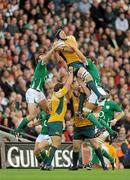 15 November 2009; Australia's Mark Chisholm claims the ball ahead of Ireland's Tommy Bowe, left, and Donncha O’Callaghan, right. Autumn International Guinness Series 2009, Ireland v Australia, Croke Park, Dublin. Picture credit: Stephen McCarthy / SPORTSFILE