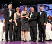14 November 2009; Edel Byrne of Monaghan is presented with her All-Star award by Pat Quill, President, Cumann Peil Gael na mBan, in the company of, from left, Tony Towell, O'Neills, Mary Davis, Managing Director, Special Olympics Europe / Eurasia and Pol O Gallchoir, Ceannsai, TG4. TG4 O'Neill's Ladies Football All-Star Awards 2009, Citywest Hotel, Conference, Leisure and Golf Resort, Dublin. Picture credit: Brendan Moran / SPORTSFILE