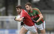 31 January 2016; Tomas Clancy, Cork, in action against Jason Gibbons, Mayo. Allianz Football League, Division 1, Round 1, Cork v Mayo. Páirc Ui Rinn, Cork. Picture credit: Diarmuid Greene / SPORTSFILE