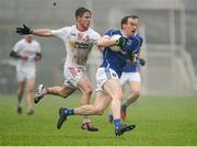 31 January 2016; Martin Reilly, Cavan, in action against Mark Bradley, Tyrone. Allianz Football League, Division 2, Round 1, Tyrone v Cavan, Healy Park, Omagh, Co. Tyrone. Picture credit: Oliver McVeigh / SPORTSFILE