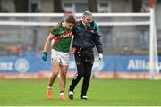 31 January 2016; Lee Keegan, Mayo, is assisted off the pitch by Dr Sean Moffatt after picking up an injury. Allianz Football League, Division 1, Round 1, Cork v Mayo. Páirc Ui Rinn, Cork. Picture credit: Diarmuid Greene / SPORTSFILE