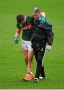 31 January 2016; Lee Keegan, Mayo, is helped off the pitch by Dr. Sean Moffatt. Allianz Football League, Division 1, Round 1, Cork v Mayo, Páirc Ui Rinn, Cork. Picture credit: Eoin Noonan / SPORTSFILE
