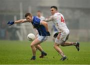31 January 2016; Niall McDermott, Cavan, in action against Cathal McCarron,  Tyrone. Allianz Football League, Division 2, Round 1, Tyrone v Cavan, Healy Park, Omagh, Co. Tyrone. Picture credit: Oliver McVeigh / SPORTSFILE