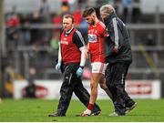31 January 2016; Eoin Cadogan, Cork, makes his way off the pitch with Dr. Con Murphy, right and Dr. Aidan Kelleher, left. Allianz Football League, Division 1, Round 1, Cork v Mayo, Páirc Ui Rinn, Cork. Picture credit: Eoin Noonan/SPORTSFILE
